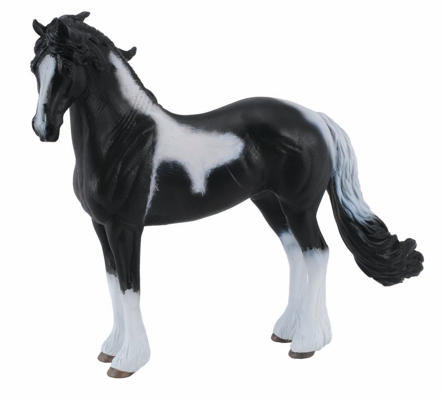 A Collecta Barock Pinto Stallion figurine with black and white coloring and a distinctive white tail.