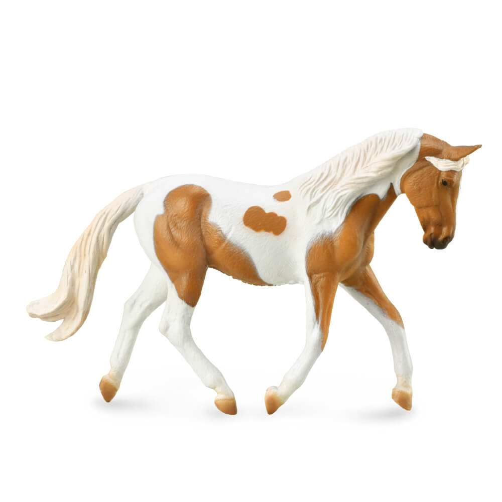 Collecta Palomino Pinto Mare. A Collecta figurine of a Palomino Pinto Mare horse with a white body, brown spots, and a blonde mane and tail.