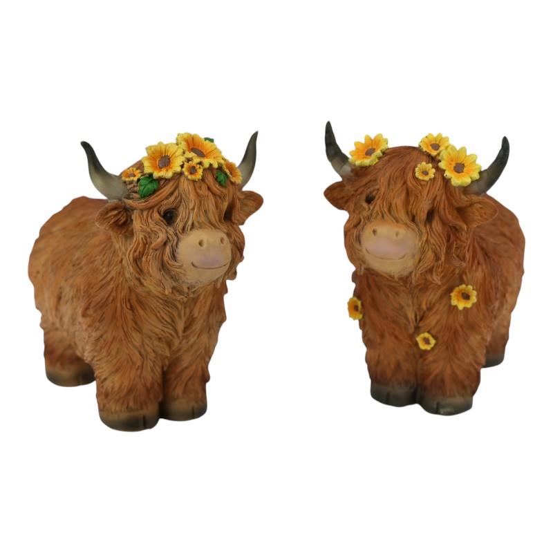 Malmar Higland Cow with Sunflowers Assorted*. Two decorative Highland cow figurines with flower crowns on a white background
