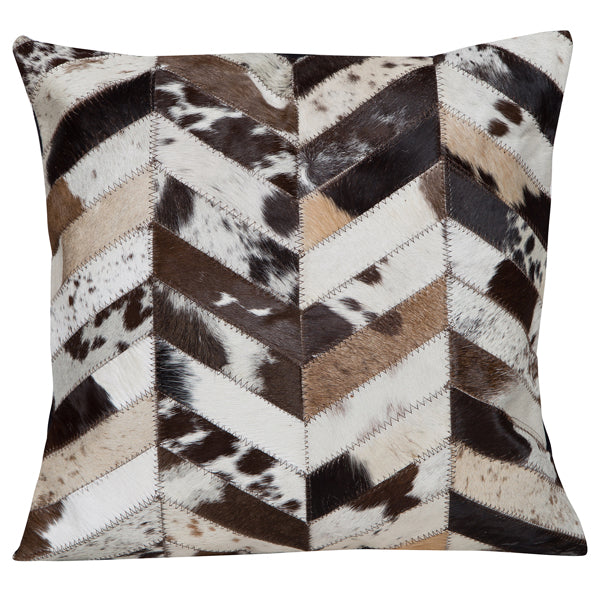 Patched Cowhide Cushion. Decorative pillow with a chevron pattern of brown, black, and white cowhide leather.