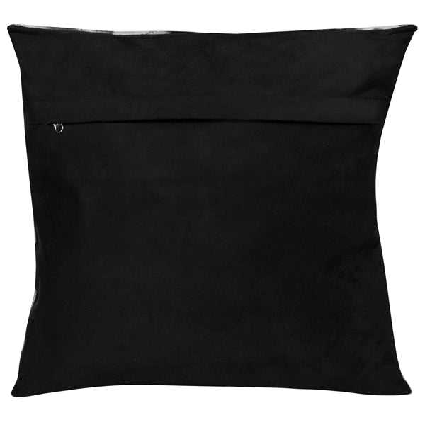 Single Panel Cowhide Cushion. Cow print pillow with black and white pattern on a plain background