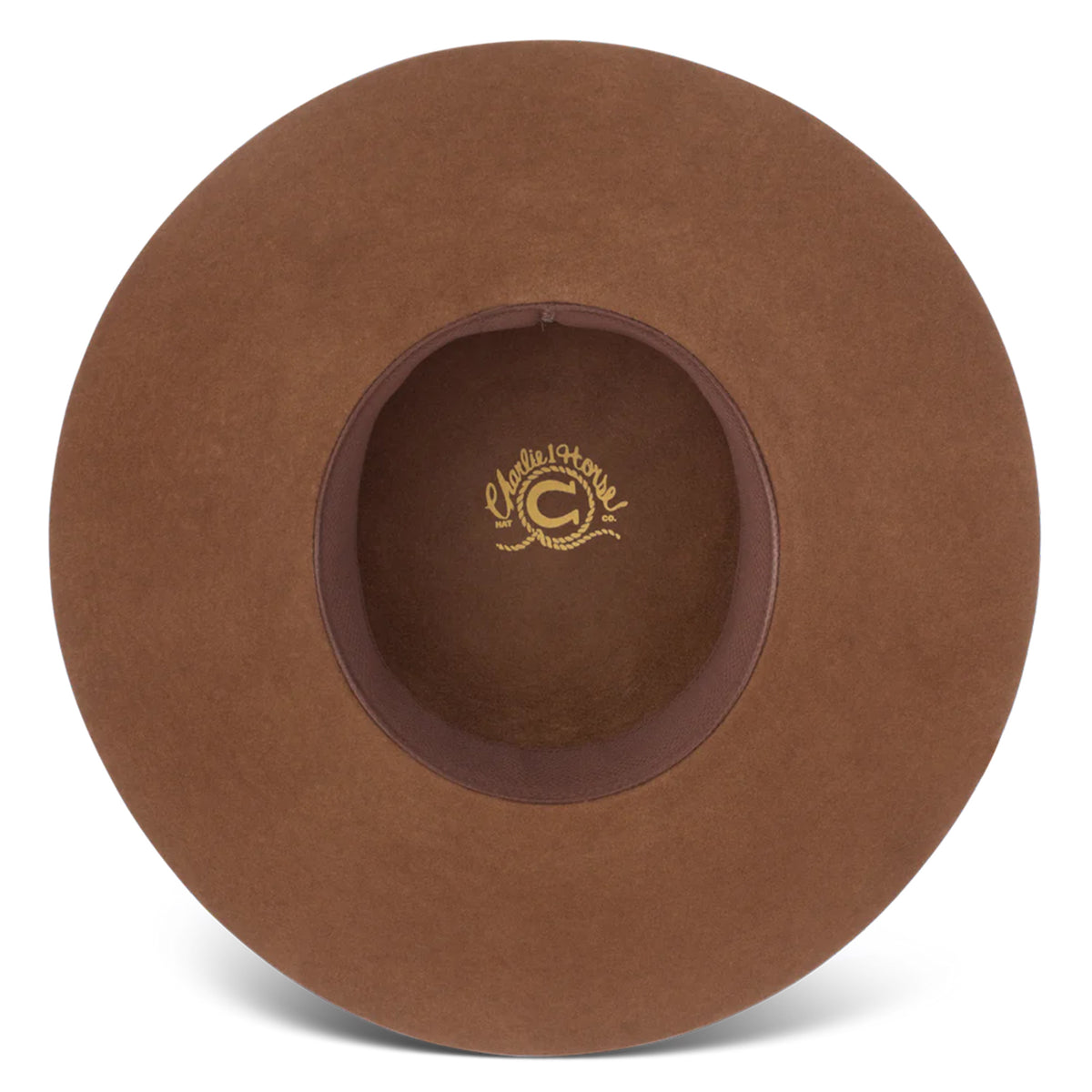 Charlie 1 Horse Wanderlust Felt Cowboy Hat. A brown wool cowboy hat with a bubble crown and a brim, featuring a woven hatband with a silver side concho and a small feather, and the Charlie 1 Horse brand logo on the crown.