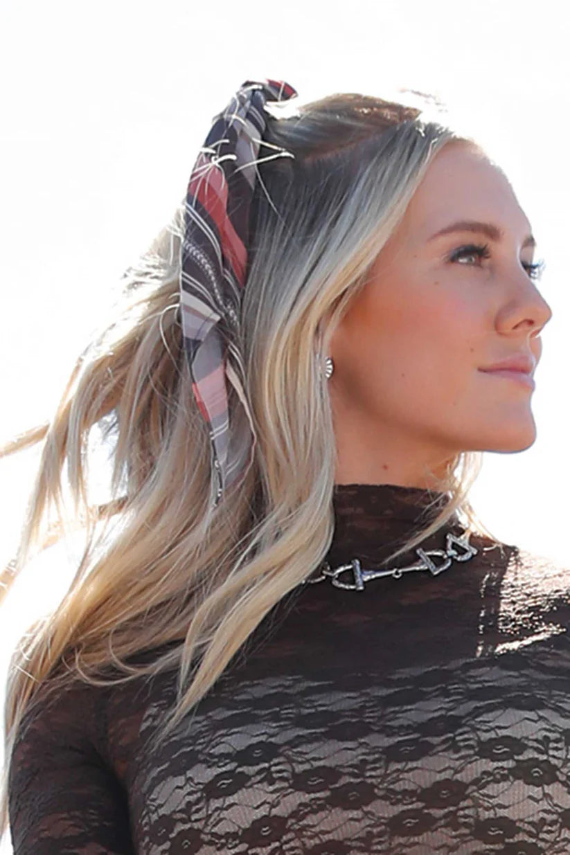 Cruel Denim Women's Wild Rag Bundle. Colorful striped scarf tied around a metal hook on a wooden post.