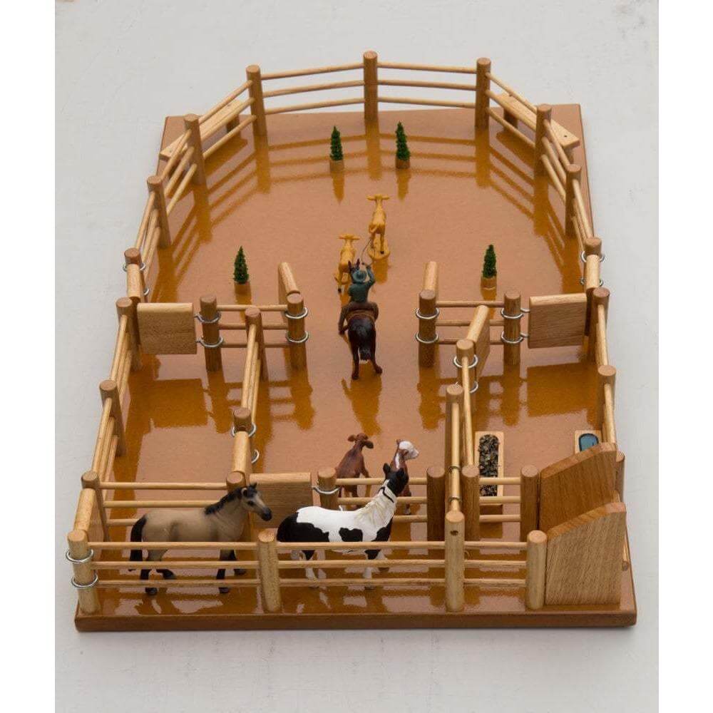 Country Toys Campdraft Yard. A wooden toy set resembling a campdraft yard with fences and animals. It includes a loading ramp, water and feed trough.