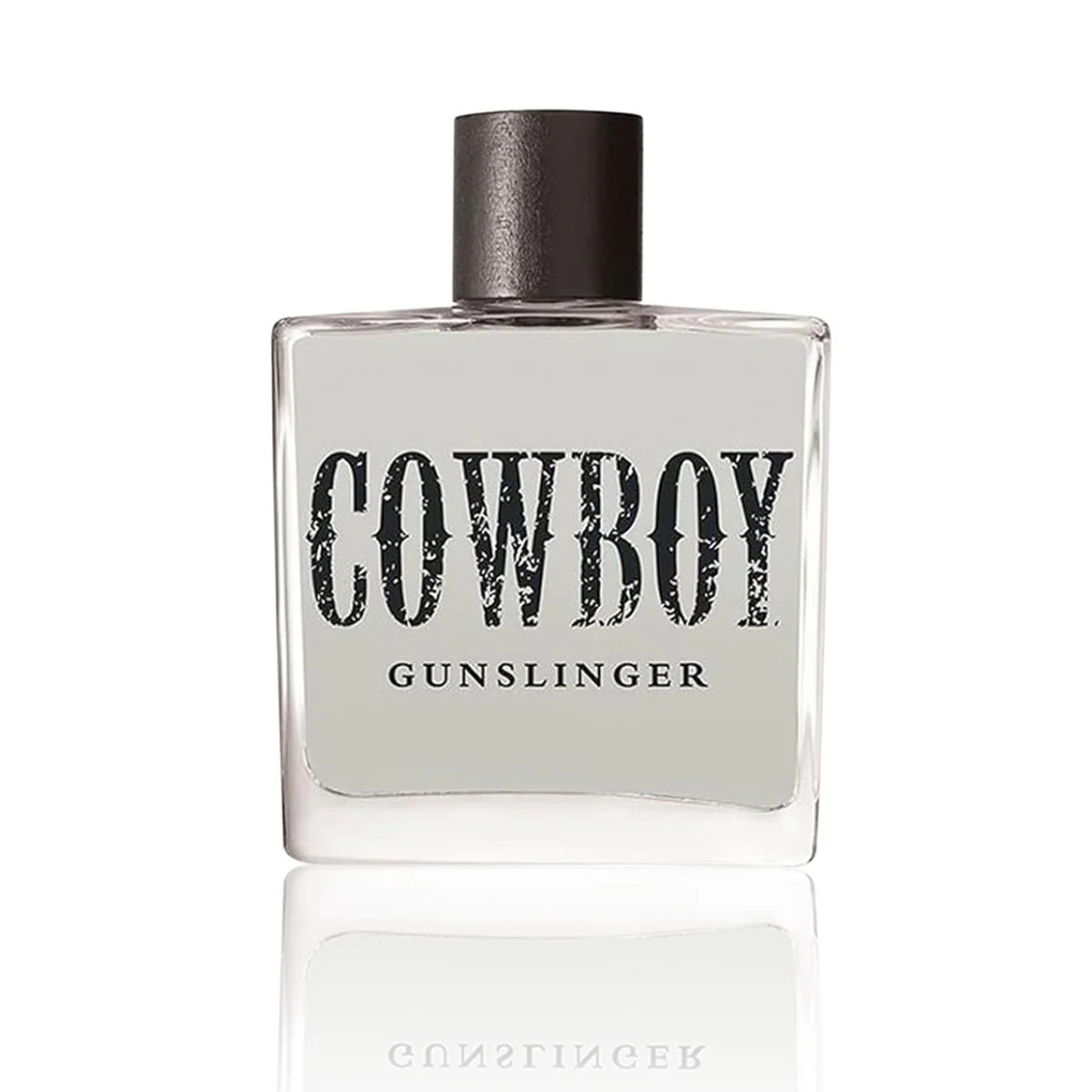 A square glass bottle of Cowboy Gunslinger fragrance with a dark metallic cap, featuring a light gray label with distressed black lettering, set against a clean white background with a soft reflection below.
