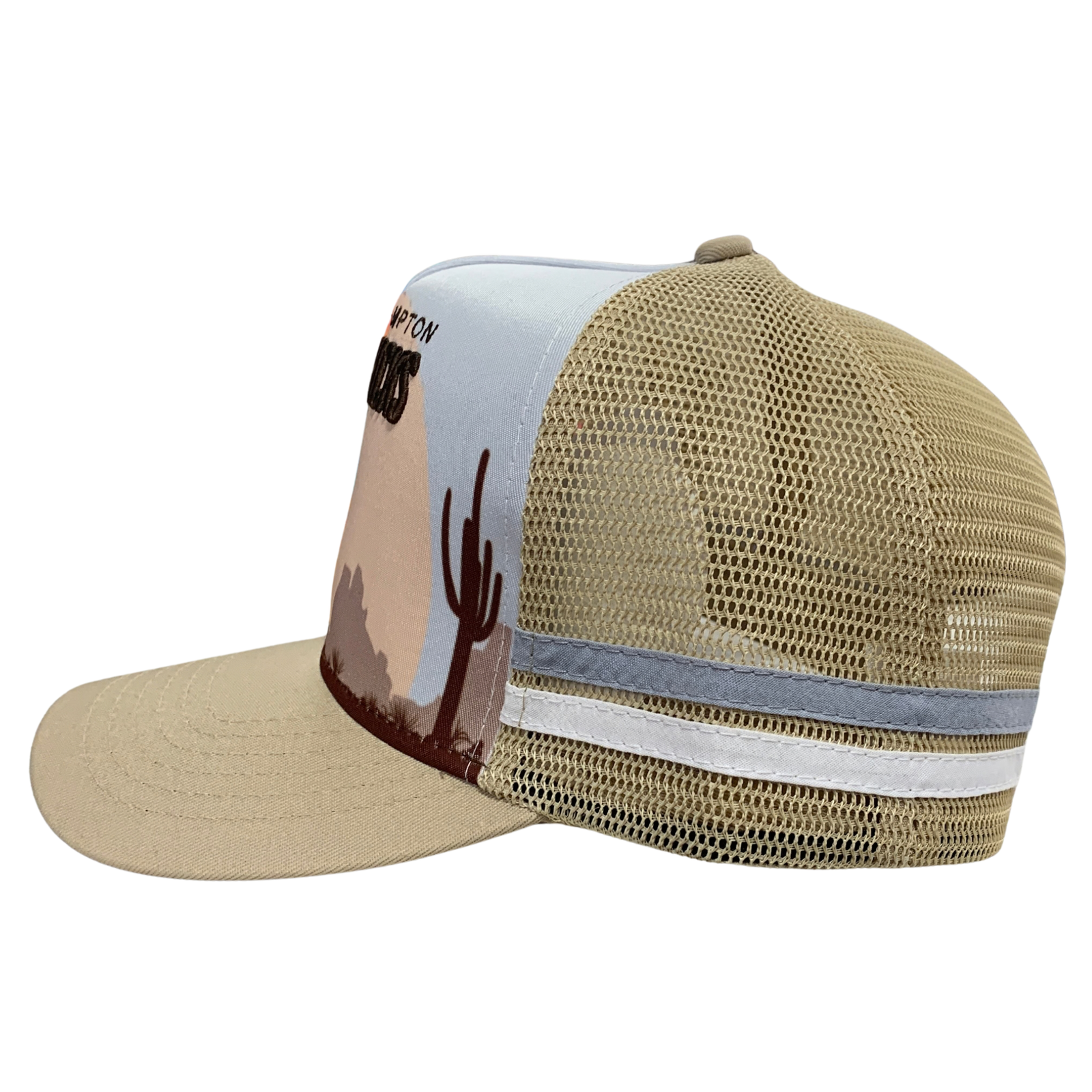 A beige and light blue trucker hat with a desert landscape graphic on the front panel, featuring a tan mesh back and a white stripe on the side.
