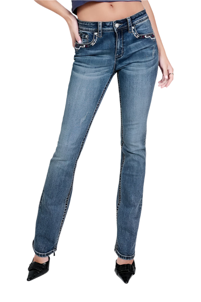 Grace In LA Women's Aztec Embroidery Jean. A pair of women's bootcut jeans with aztec embellishments on the back pockets and embroidered designs. The jeans are displayed on a model wearing black heels.