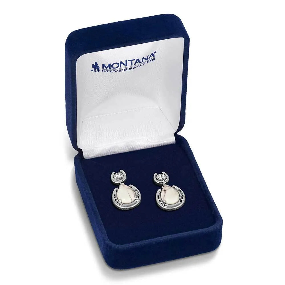 Pair of earrings in a blue jewelry box with 'Montana Silversmiths' branding.