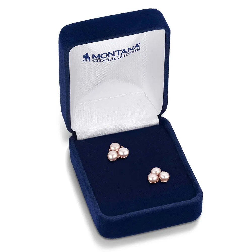 Pair of pearl earrings in a Montana Silversmiths box on a white background
