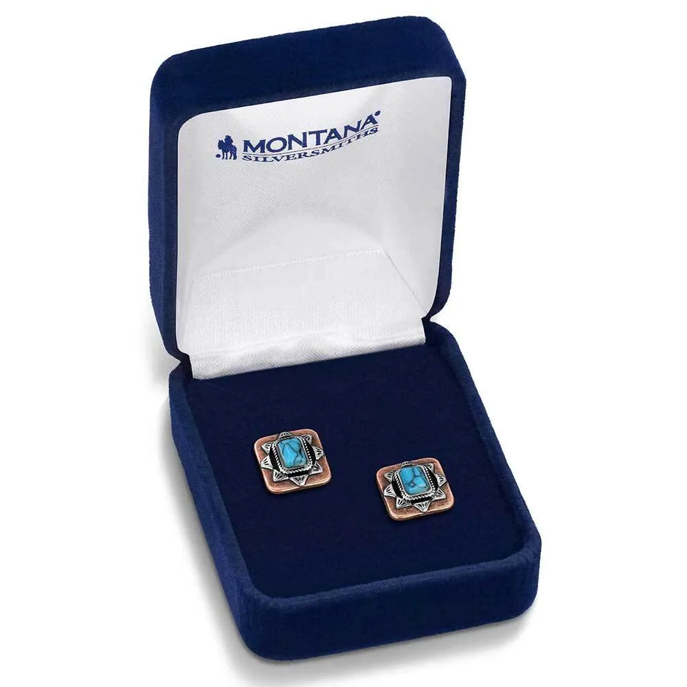 Diamond ring in a blue velvet box with 'Montana Silversmiths' branding.
