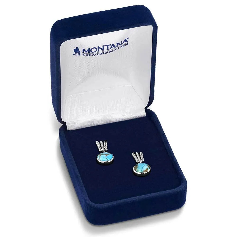Pair of silver earrings with turquoise stones in a Montana Silversmiths box.
