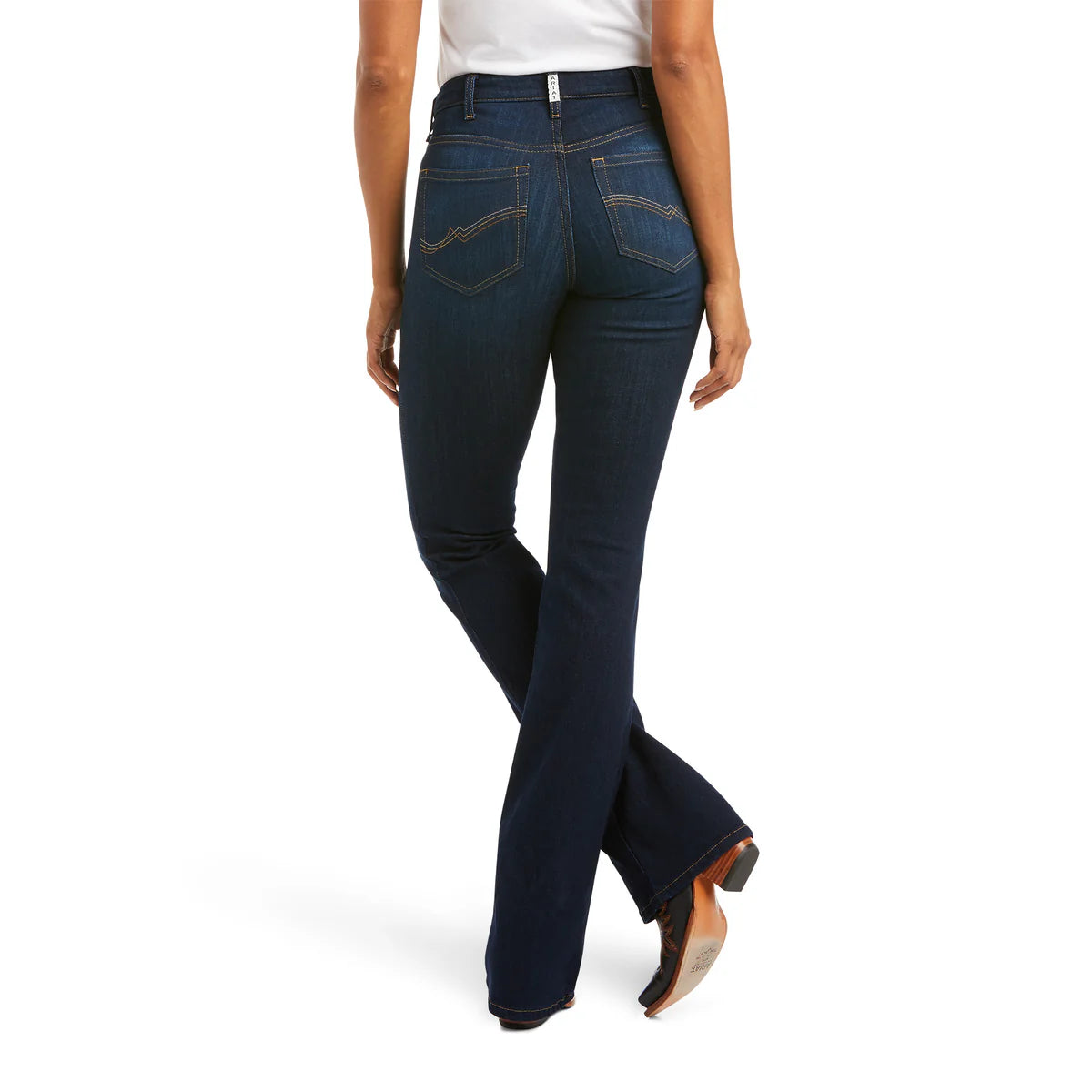 Person wearing blue jeans on a white background