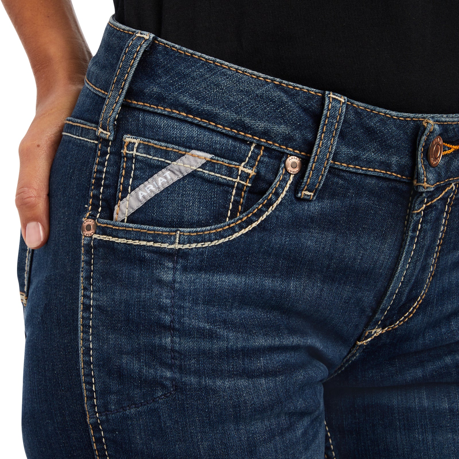 Close-up of blue jeans with a focus on the pocket area.