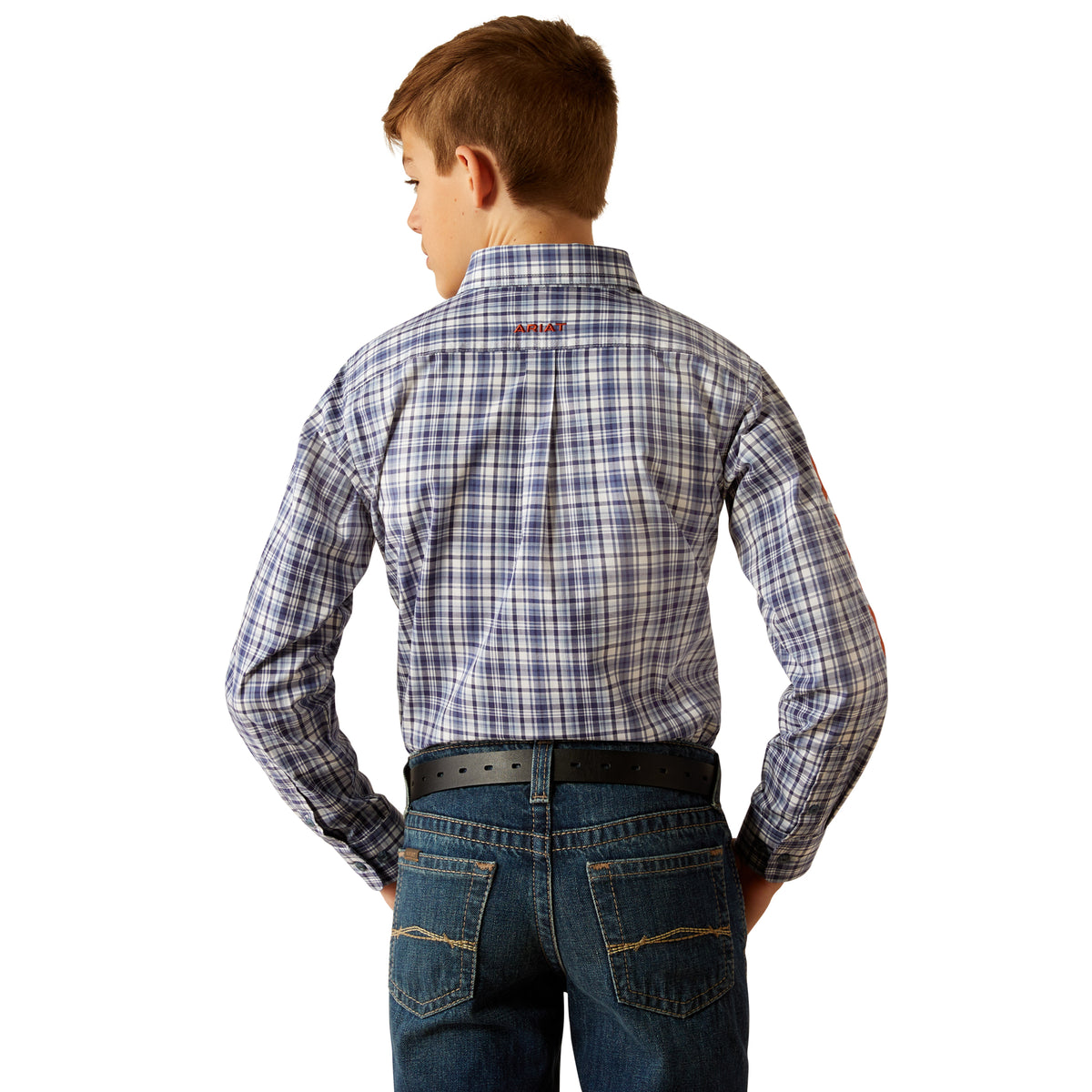 Ariat Boy's Pro Series Team Orion L/S Western Shirt. A boy is shown from the back wearing a long-sleeved plaid Western shirt in blue and white tones, paired with blue jeans.