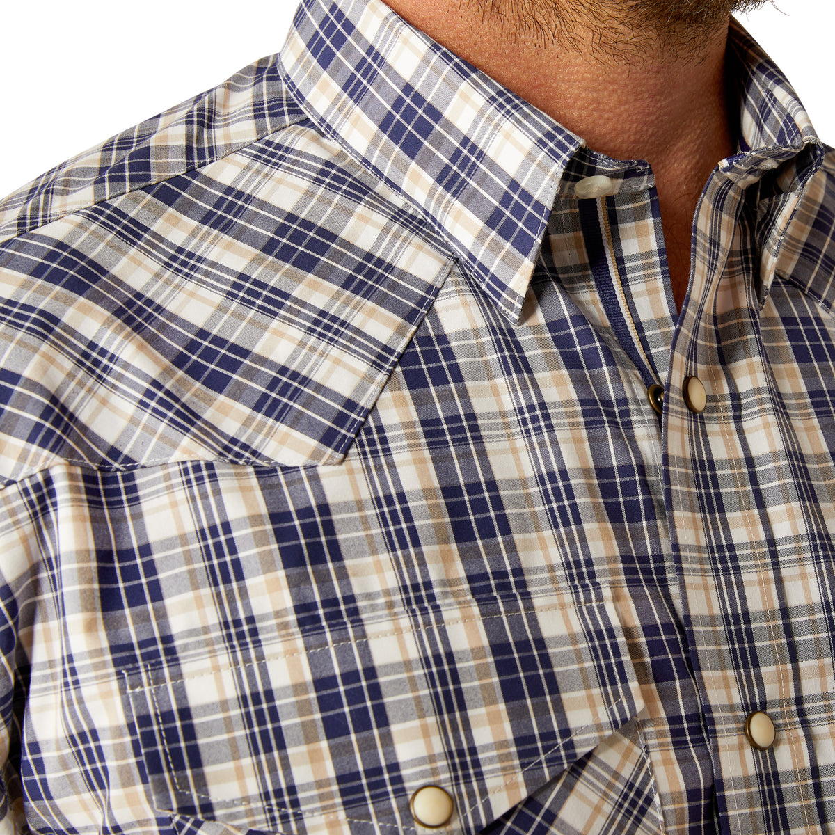 Ariat Men's Pro Series Caine L/S Snap Western Shirt. Close-up of a plaid shirt with buttons and collar.