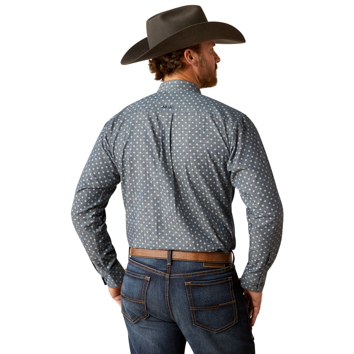 Ariat Men's Chip L/S Western Shirt. Man wearing a patterned shirt and cowboy hat from the back.