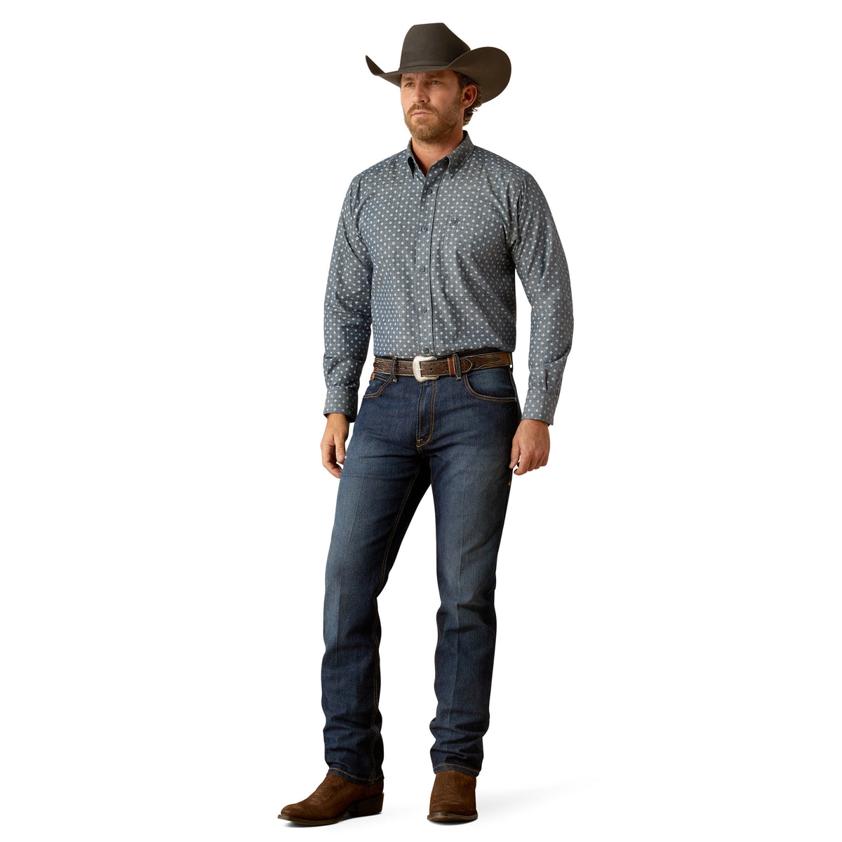 Ariat Men's Chip L/S Western Shirt. Man wearing a patterned shirt and jeans with a cowboy hat on a white background