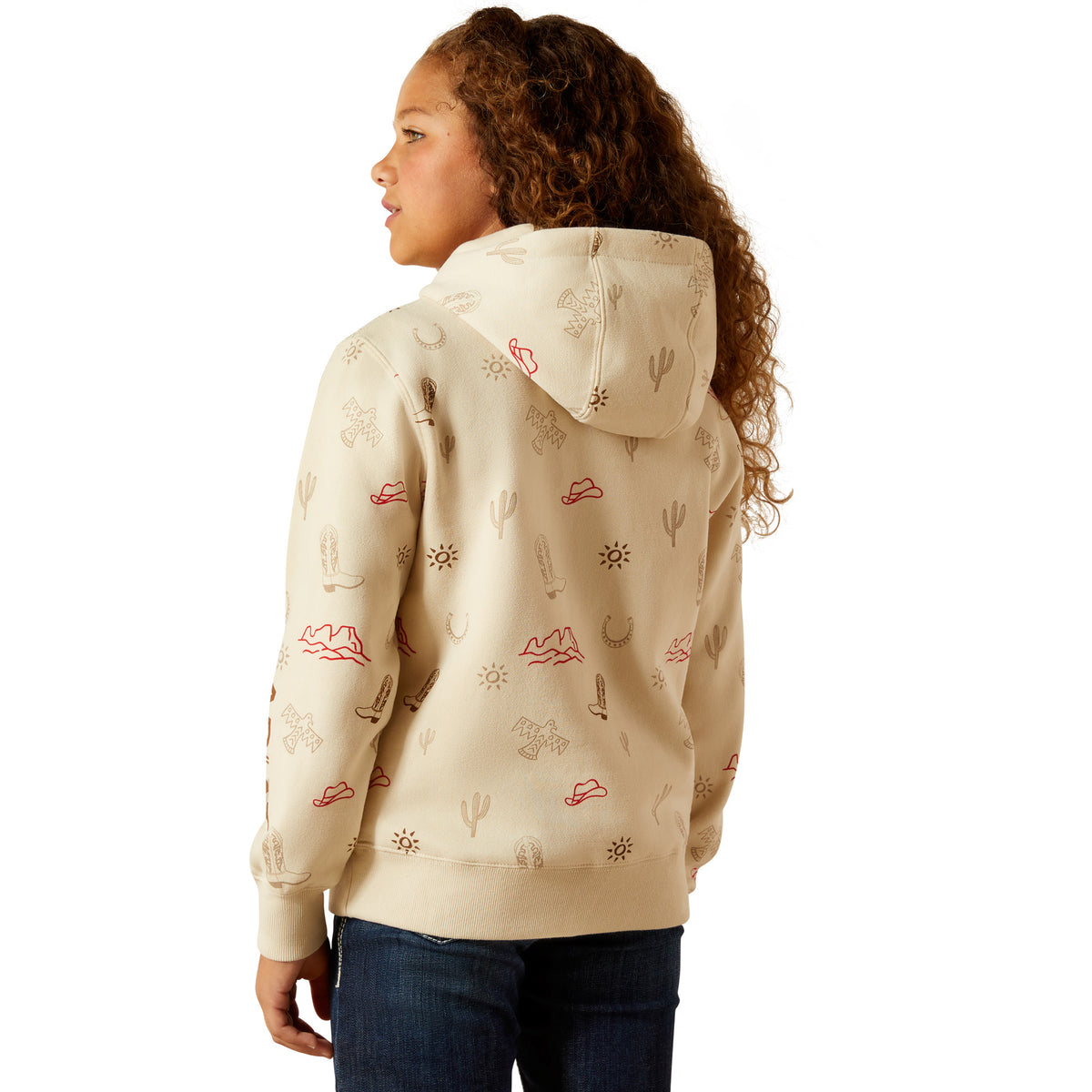 Person wearing a beige hoodie with desert-themed patterns on a white background