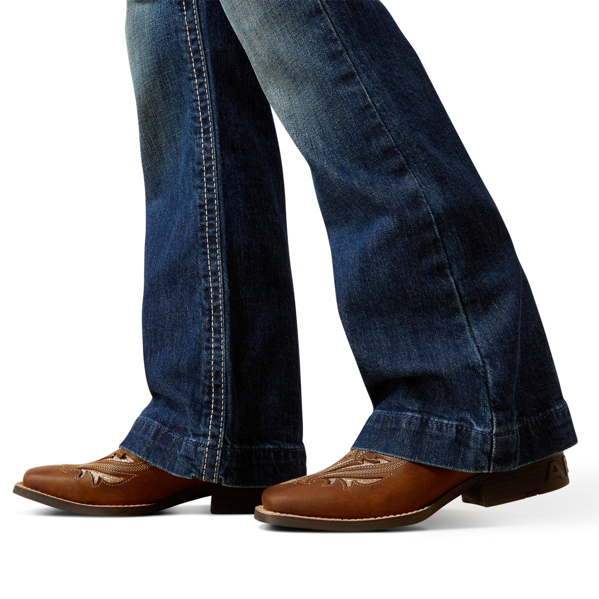 Blue jeans with brown shoes on a white background
