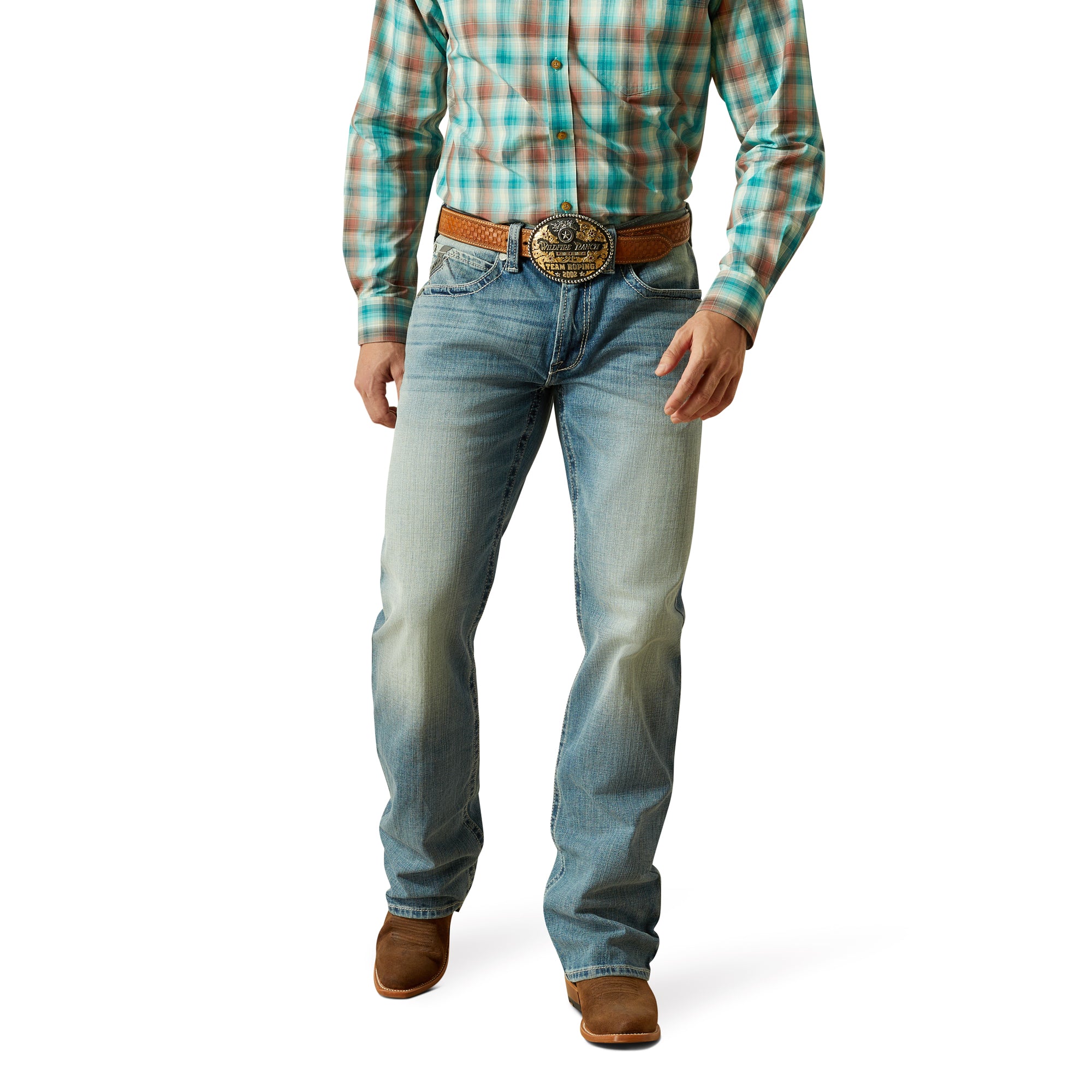 Ariat Men's M4 Thomas Relaxed Boot Cut Jean. Person wearing blue jeans and a plaid shirt with a brown belt on a white background