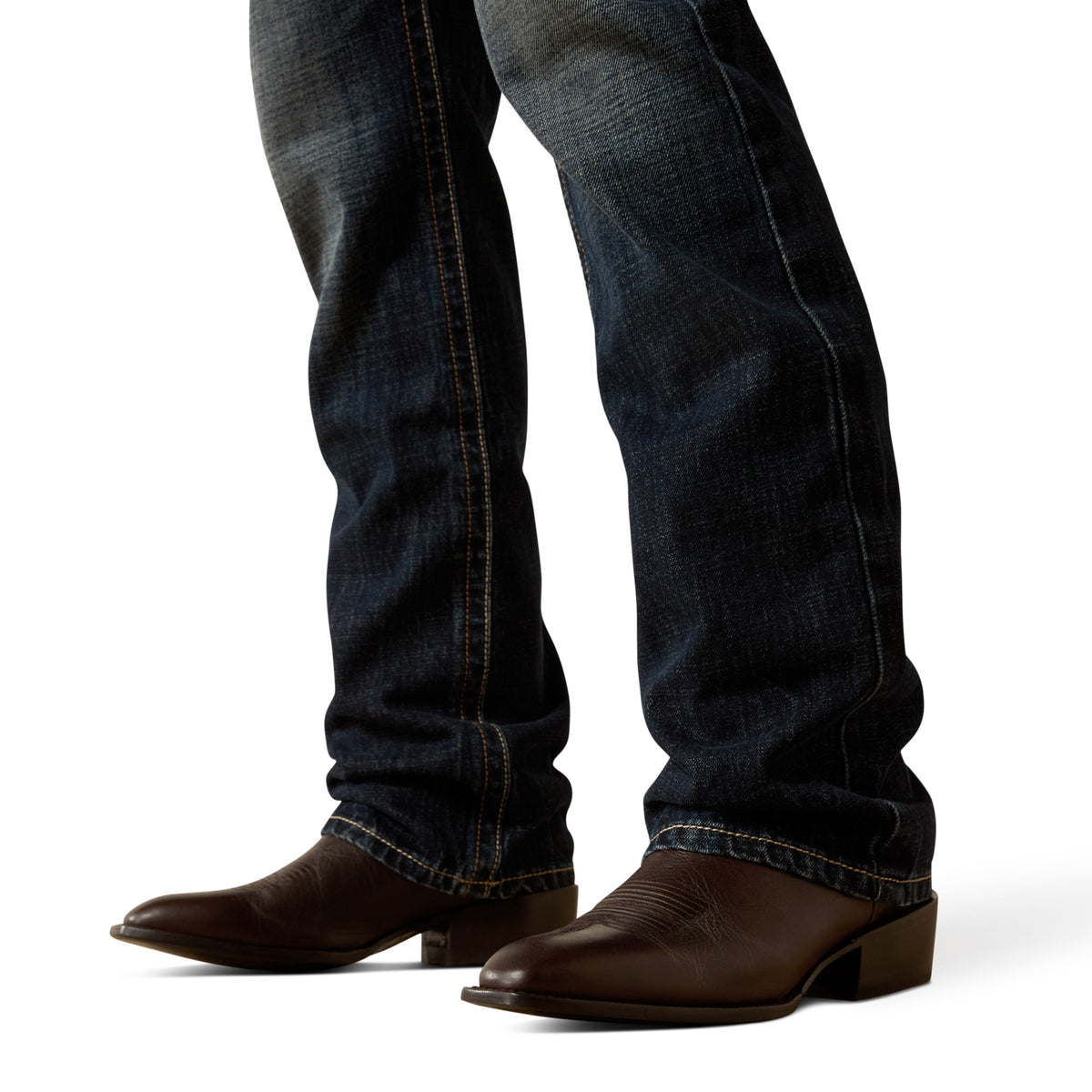 Ariat Men's M5 Keith Straight Leg Jean. Dark blue jeans and brown boots on a white background