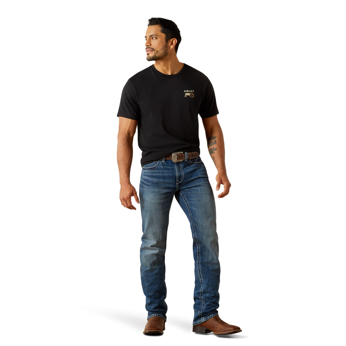 Ariat Men's M4 August Relaxed Straight Leg Jean. Man wearing a black t-shirt and blue jeans on a white background