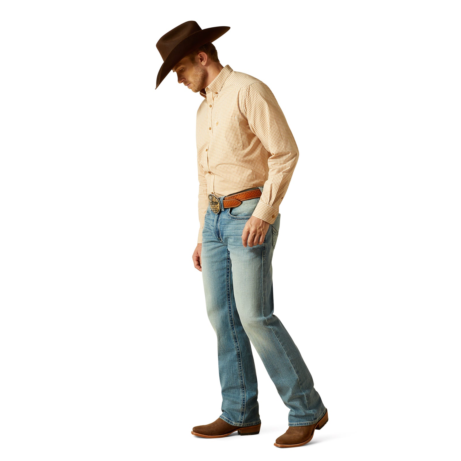 Man wearing a beige shirt, blue jeans, and a brown cowboy hat on a white background