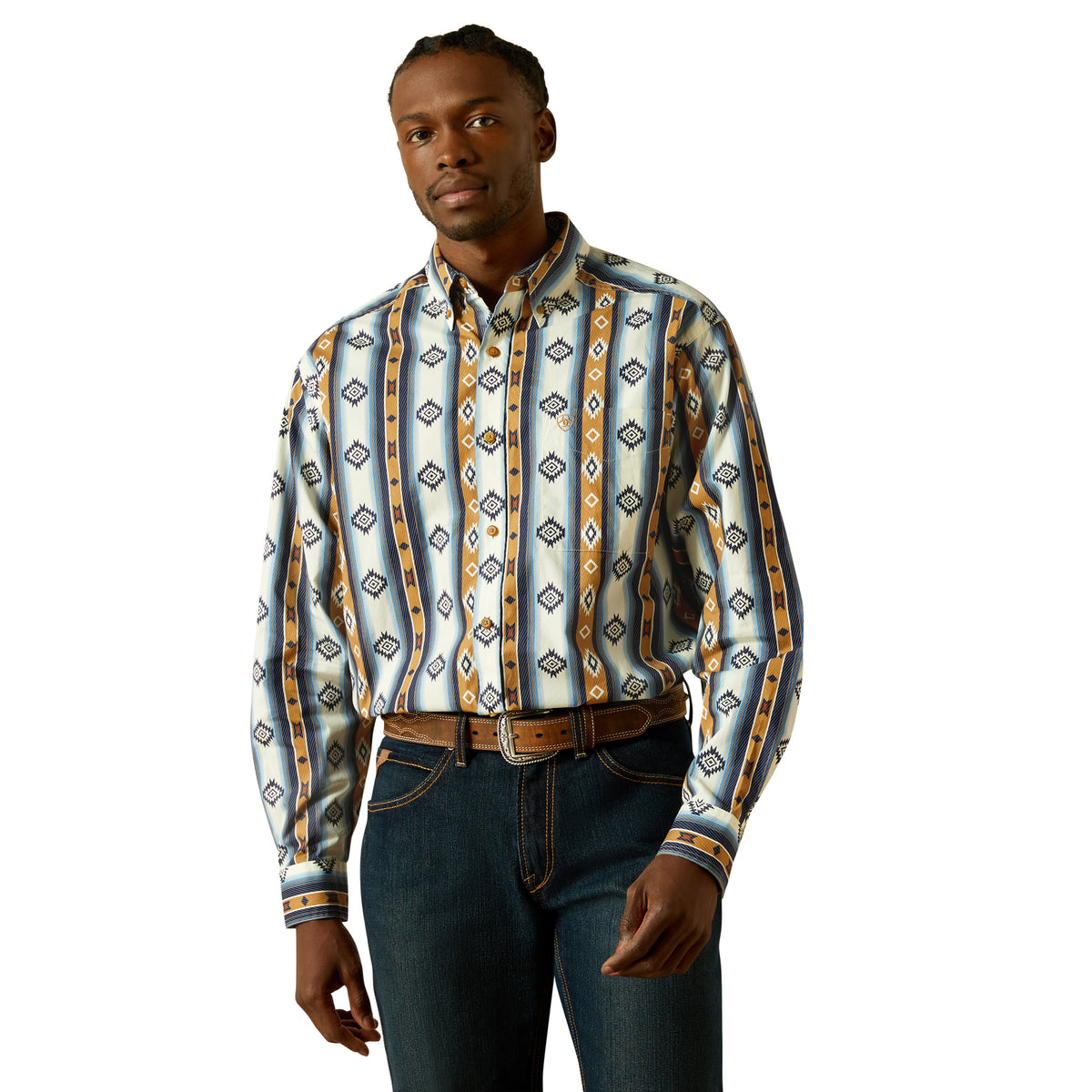 Man wearing a patterned shirt and jeans on a white background