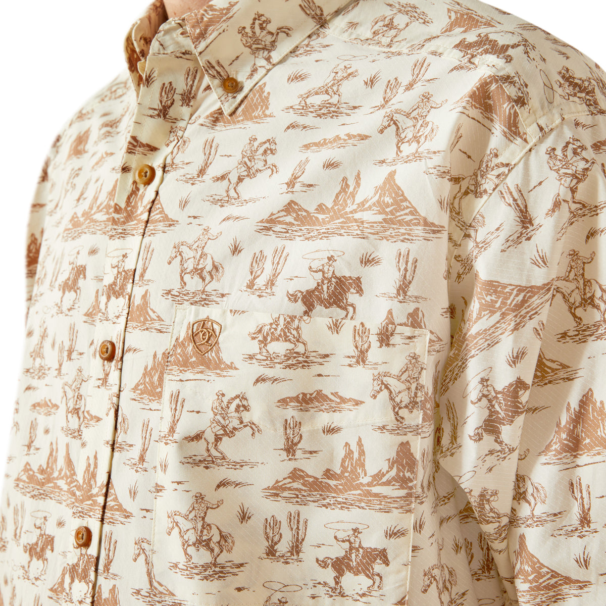 Close-up of a shirt with a cowboy pattern on a beige background