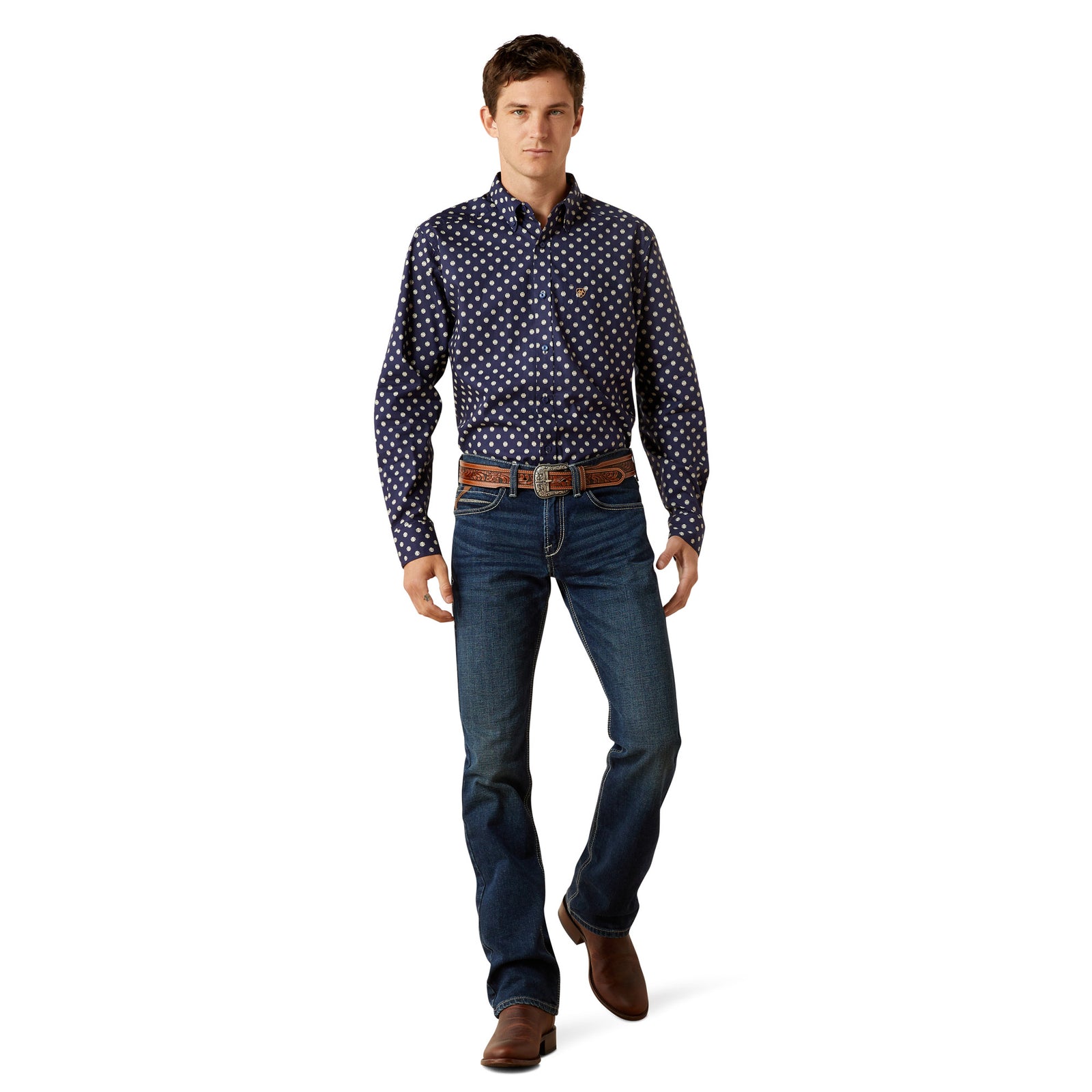 Man wearing a patterned shirt, jeans, and brown shoes on a white background
