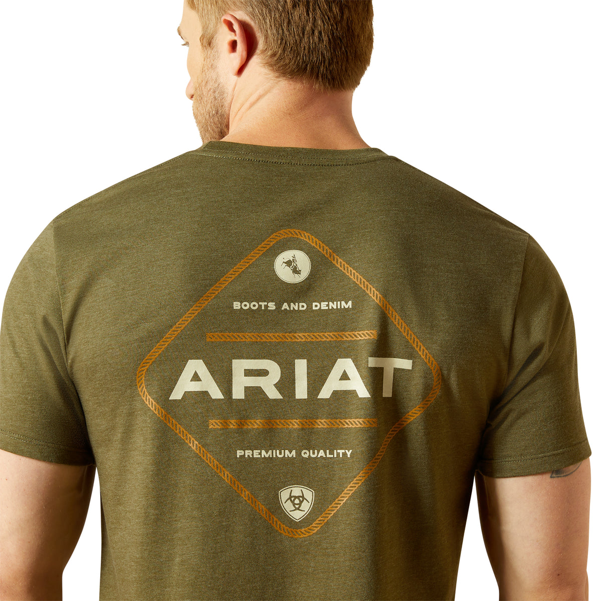 Ariat Men's Roped Diamond T-ShirtMan wearing an olive green Ariat t-shirt with branding on the back. 