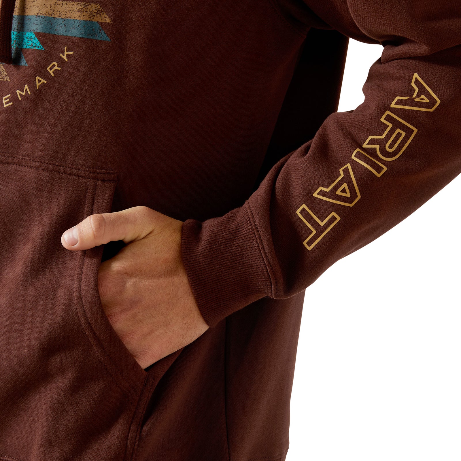 Brown hoodie with 'Ariat' branding on sleeve, worn by a person.