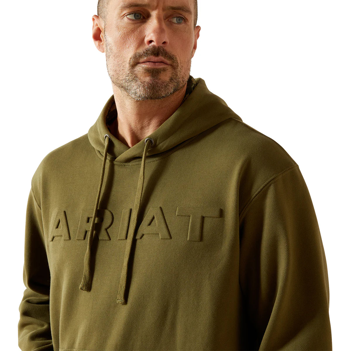 Man wearing a green hoodie with 'Ariat' branding on a white background