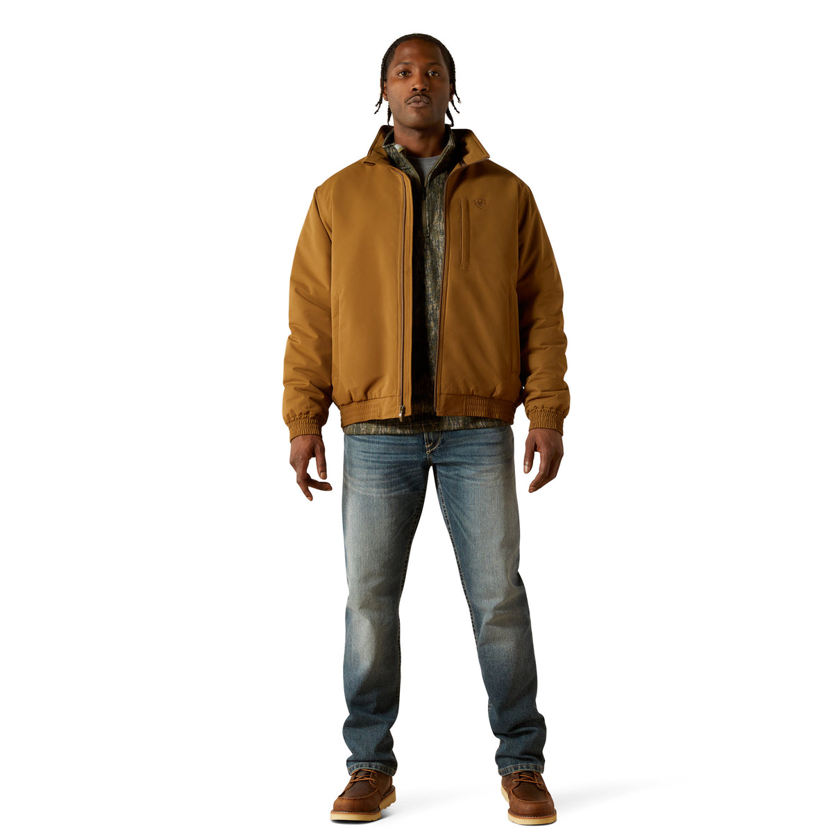 Man wearing a brown jacket and blue jeans on a white background