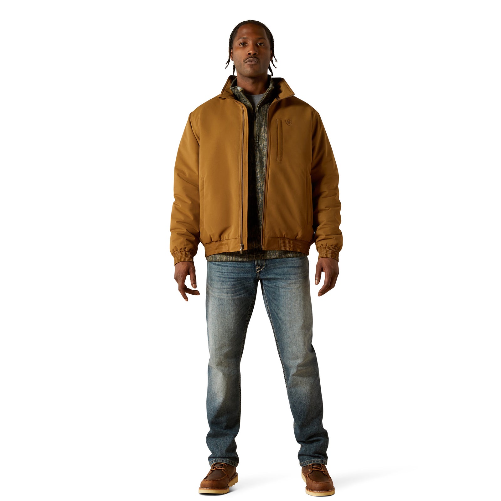 Man wearing a brown jacket and blue jeans on a white background