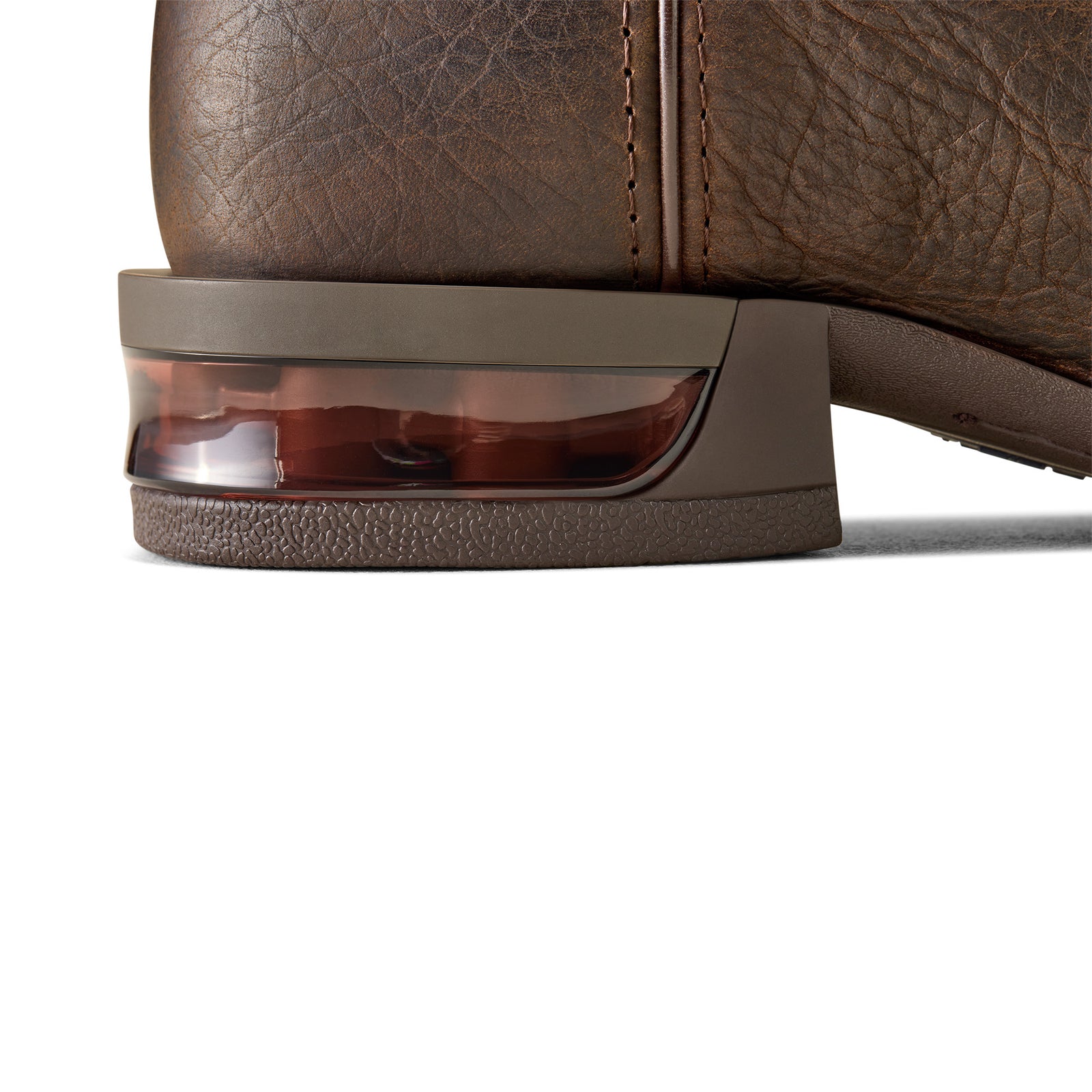 Captivate Wide Square Toe Western Boot. Close-up of a brown leather shoe with a transparent heel cup on a white background
