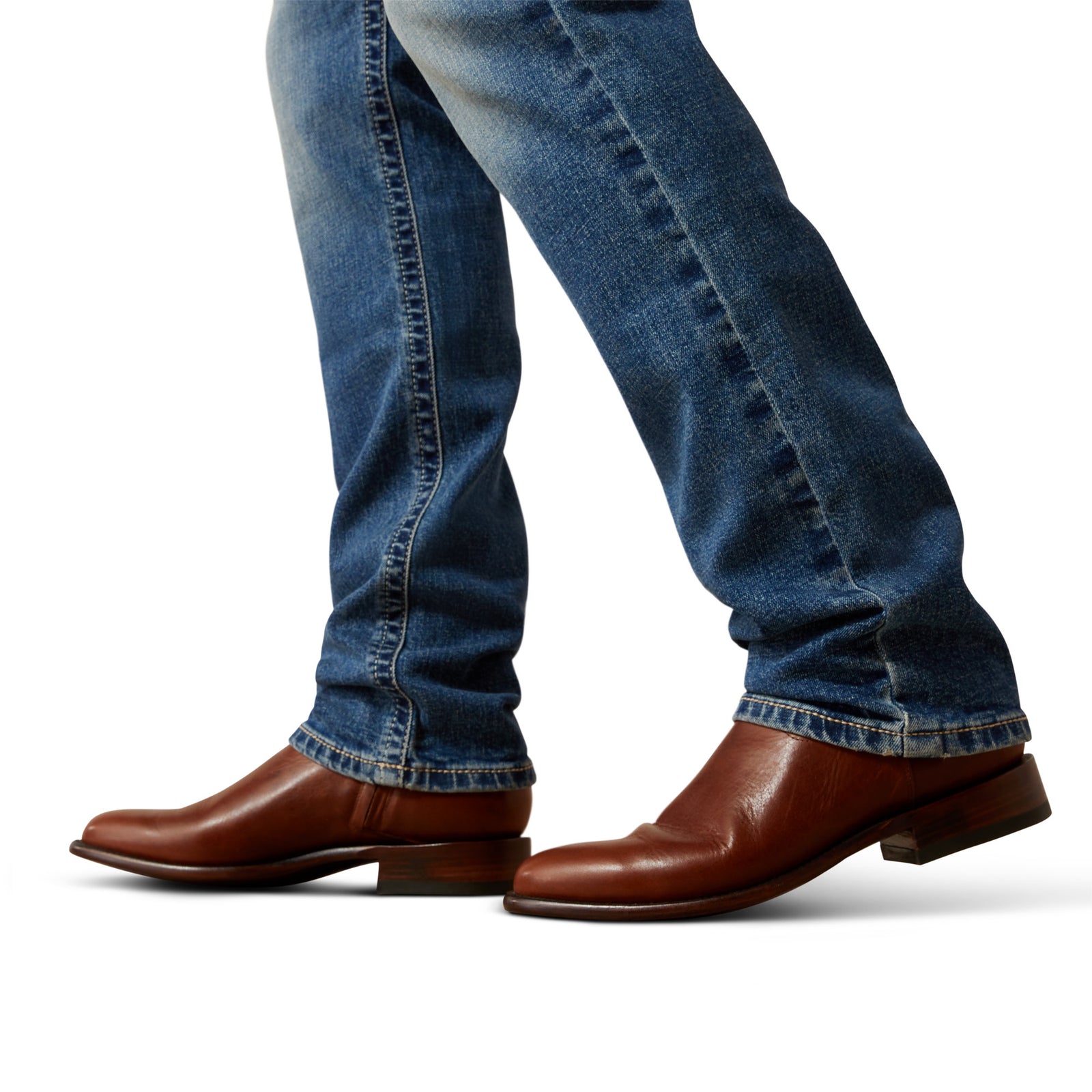 Brown leather boots and blue jeans on a white background