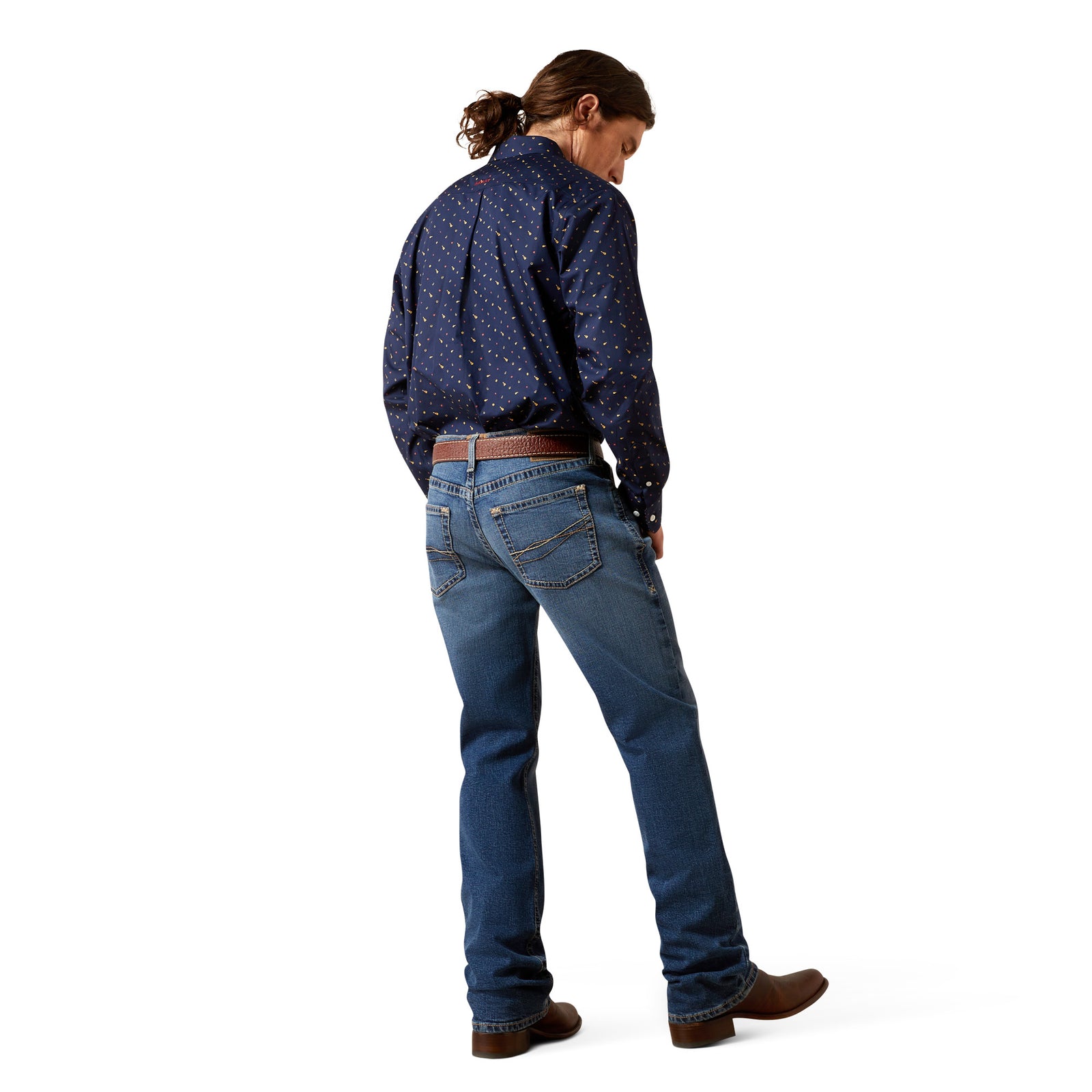 Person wearing a blue patterned shirt and jeans on a white background