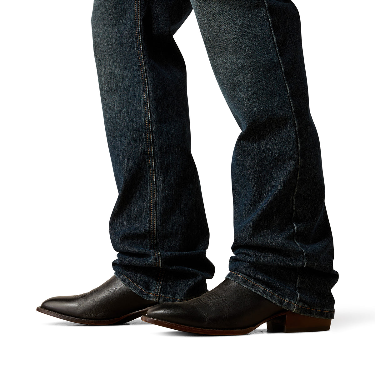 Dark blue jeans and brown boots on a white background