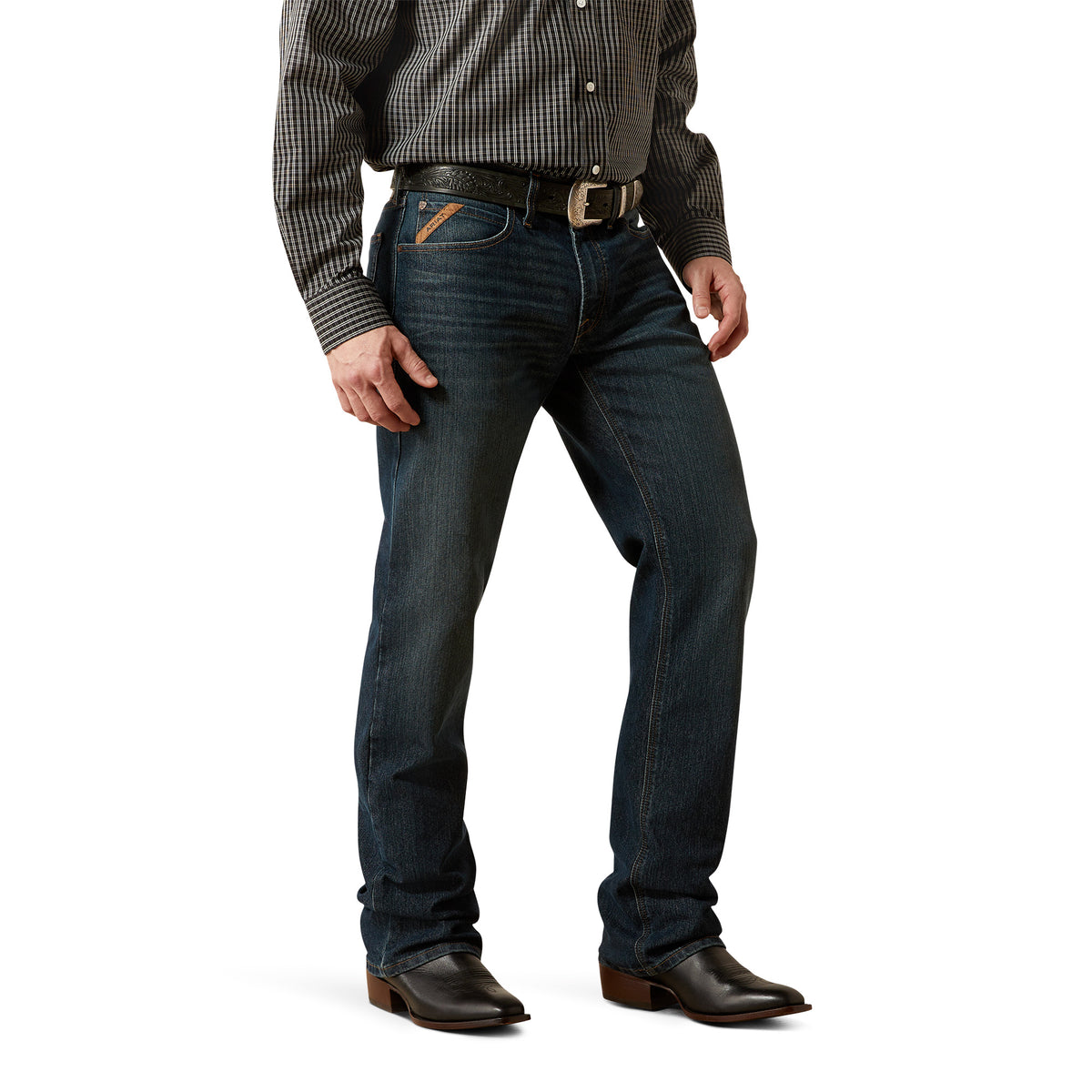 Person wearing dark blue jeans and a checkered shirt on a white background