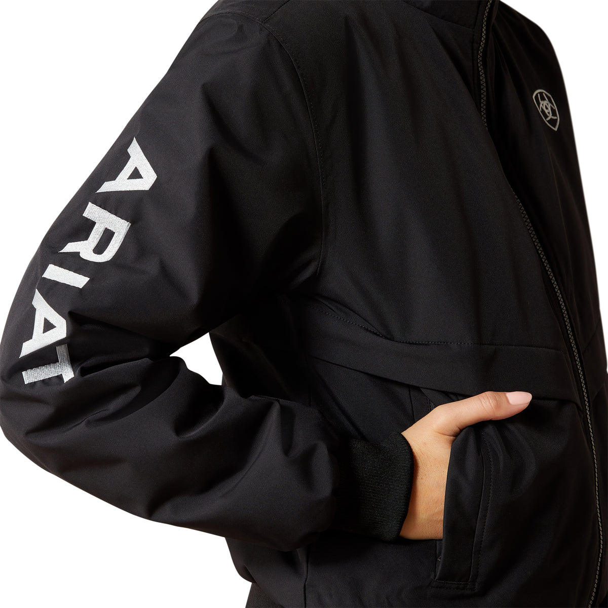 Black jacket with 'Ariat' branding on sleeve against a white background