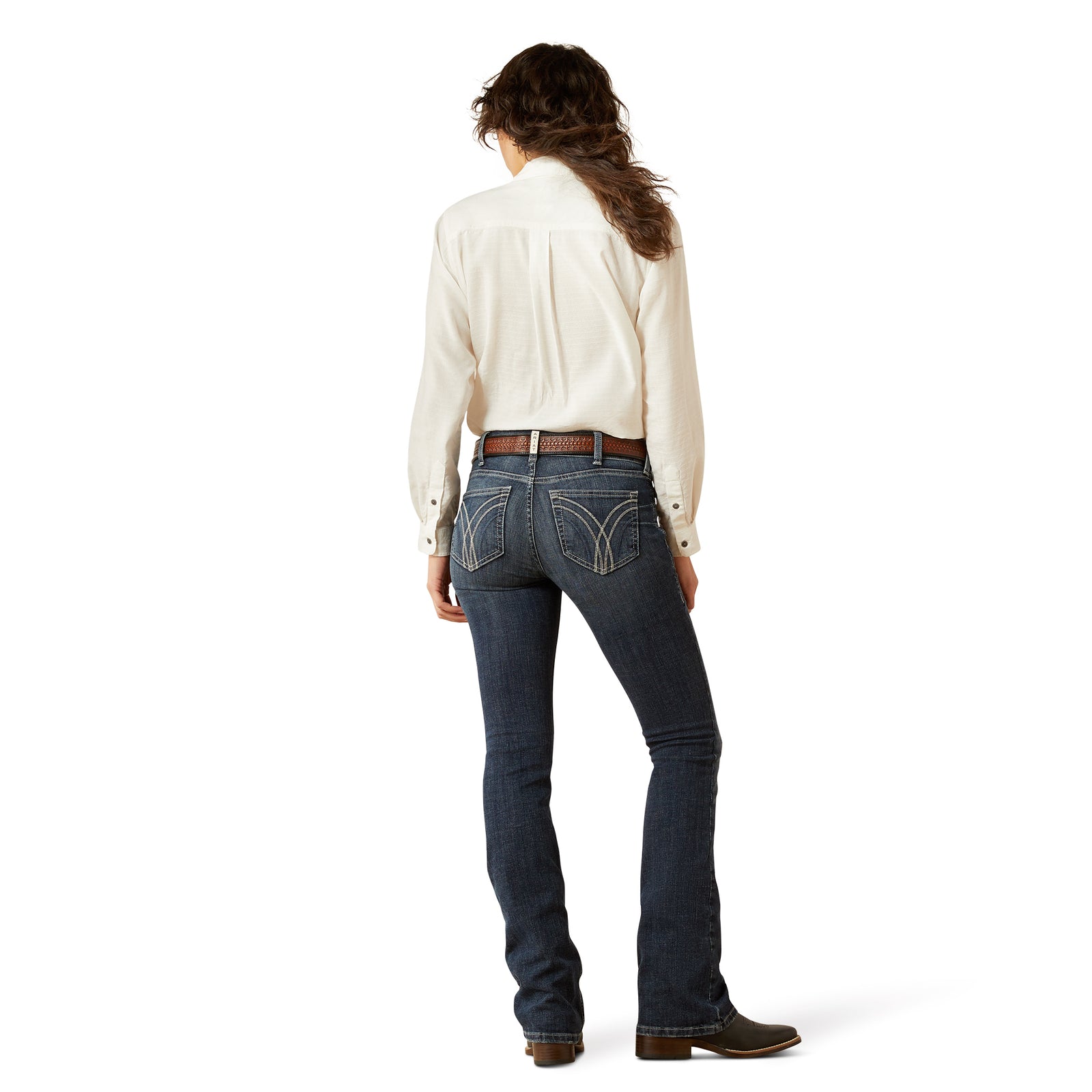 Ariat Women's Esti Perfect Rise Boot Cut Jean. Person wearing blue jeans and a white shirt on a white background