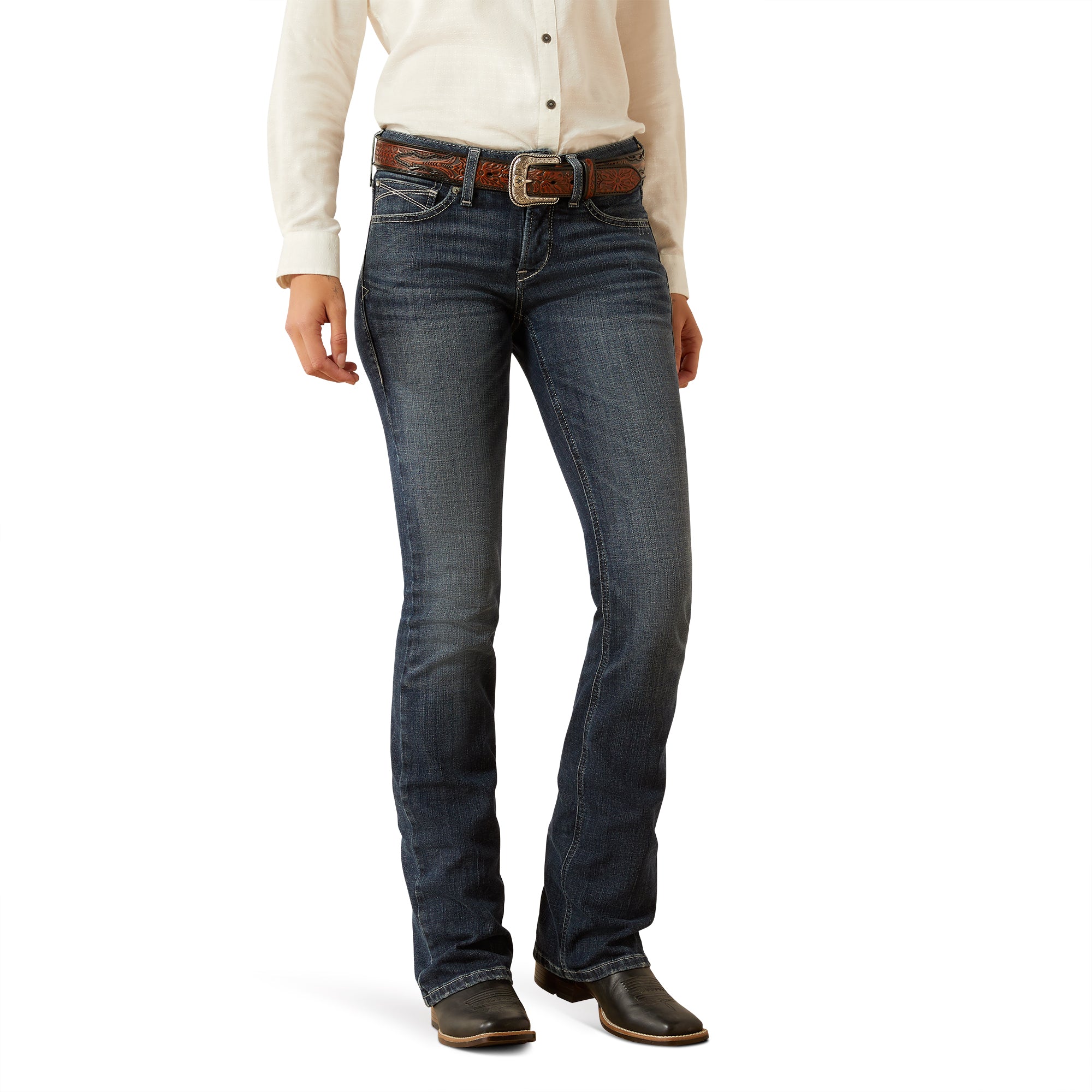 Ariat Women's Esti Perfect Rise Boot Cut Jean. Person wearing blue jeans and a white shirt on a white background