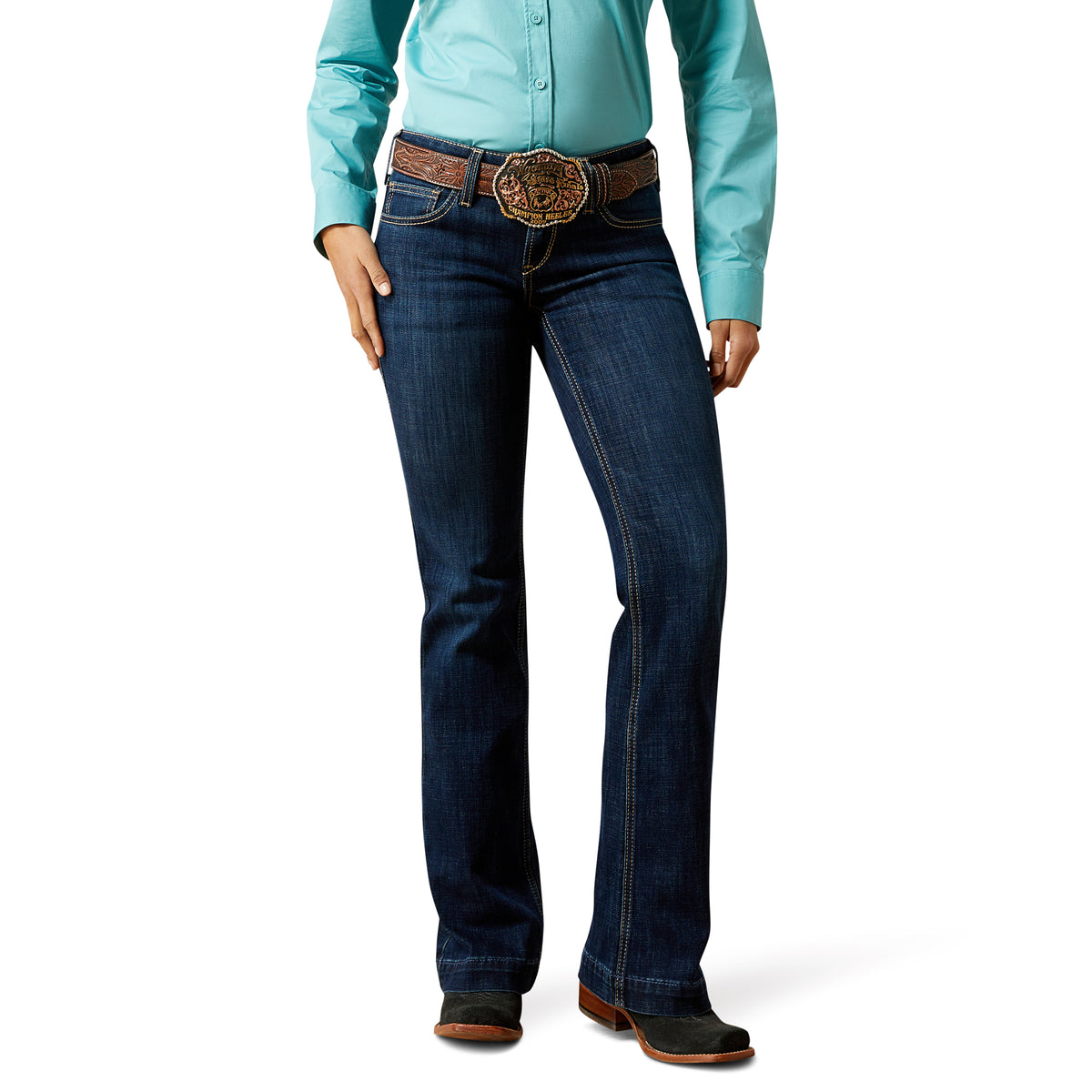 Ariat Women&#39;s Cindy Mid Rise Trouser. Person wearing blue jeans and a turquoise shirt on a white background