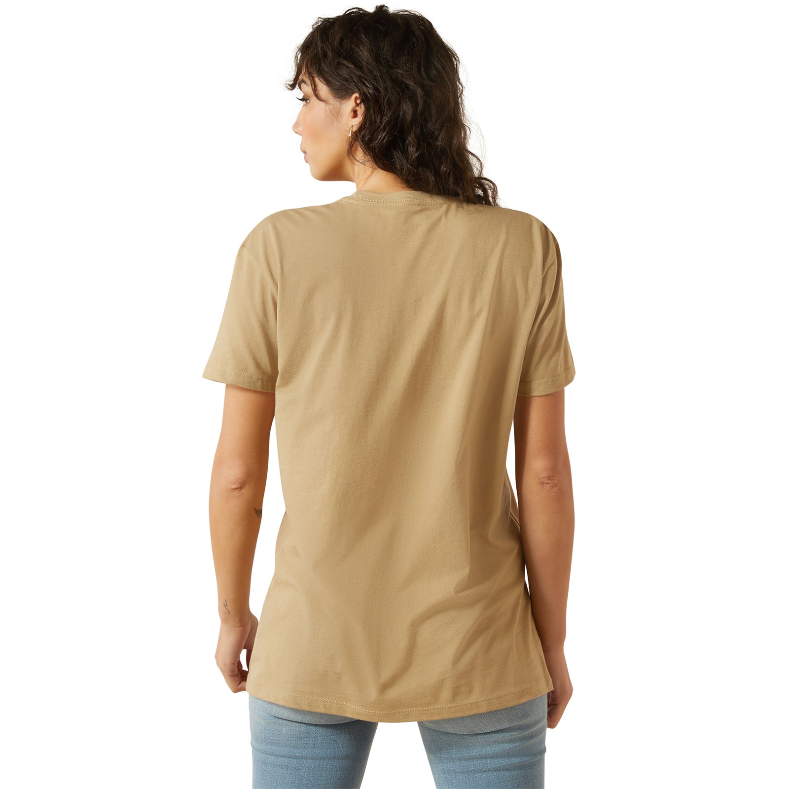 Ariat Women's Kickin Up Dust T-Shirt. Woman wearing a tan t-shirt with a graphic design and 'Ariat' branding.