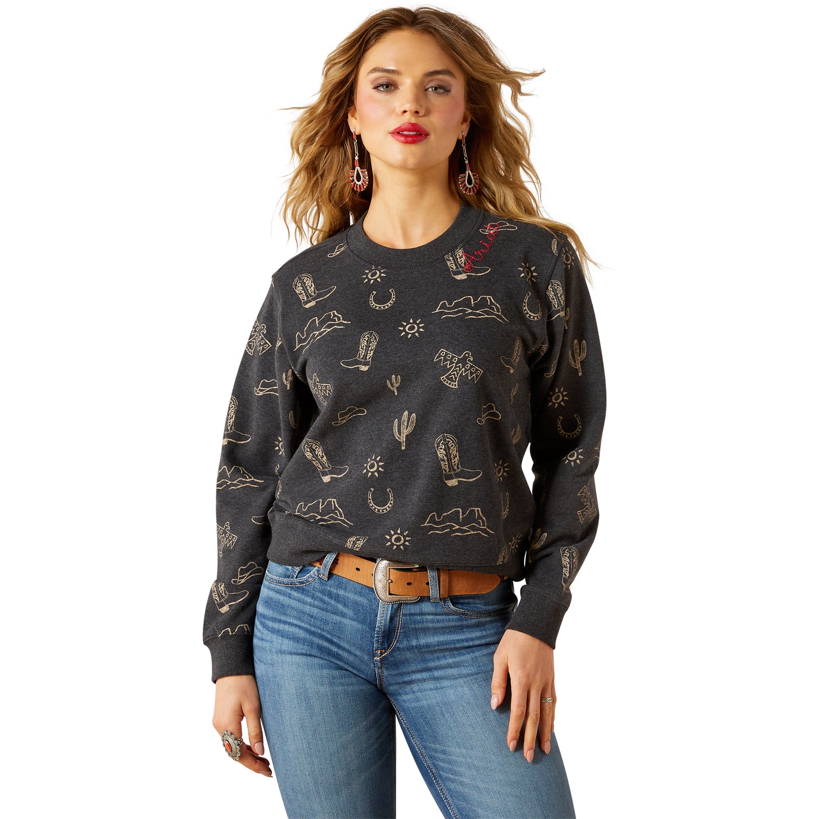 Woman wearing a dark gray sweater with cactus pattern and blue jeans on a white background