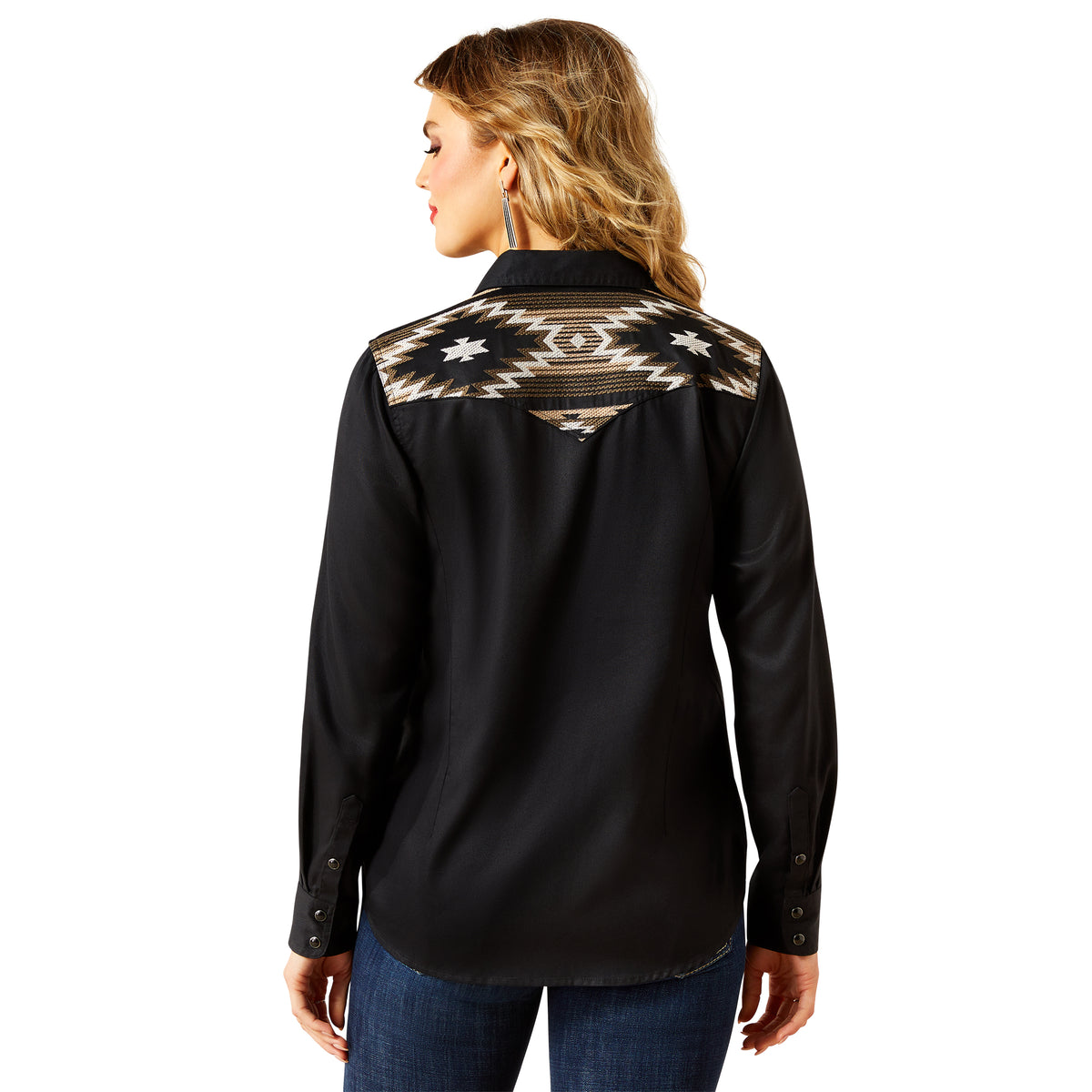 Black shirt with a patterned back design worn by a person on a white background
