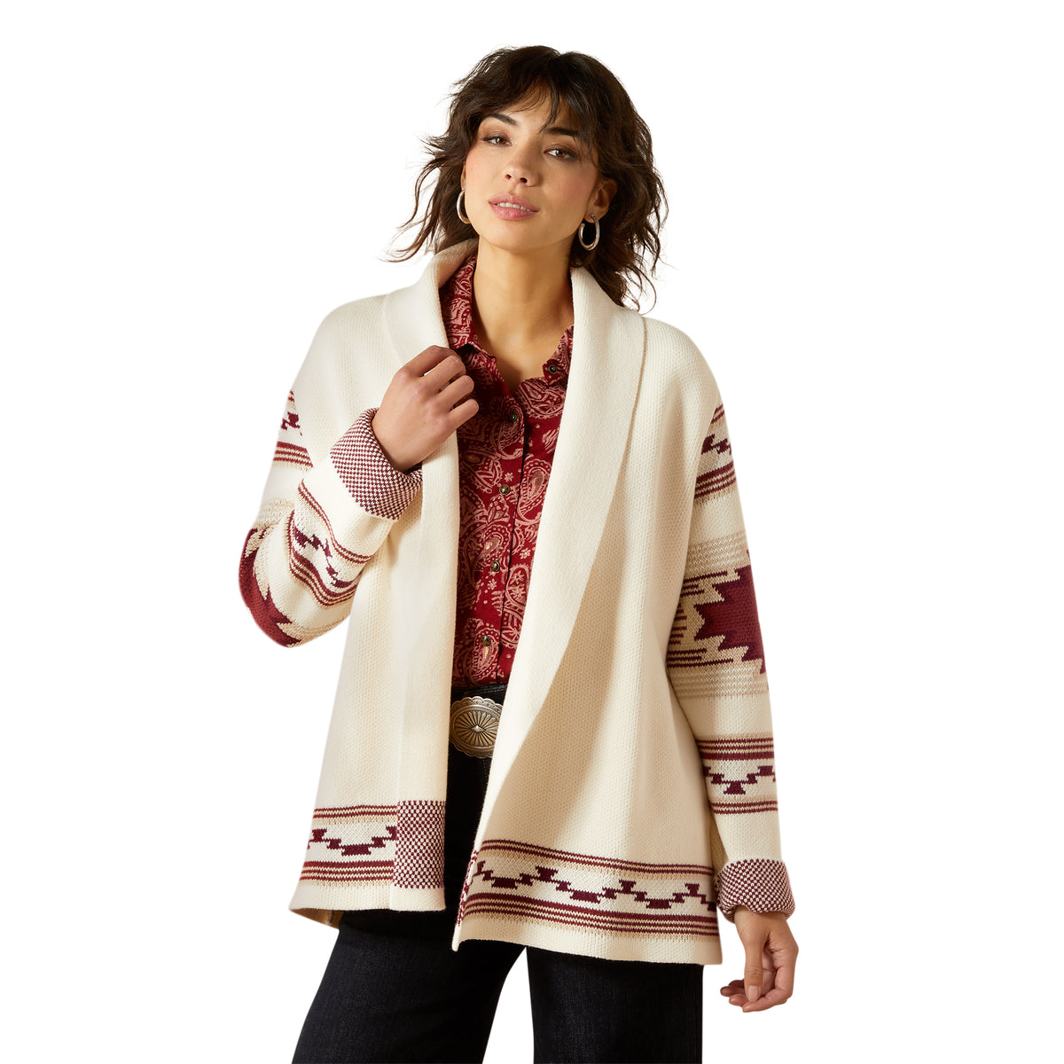 Woman wearing a cream-colored cardigan with red and brown patterns on a white background