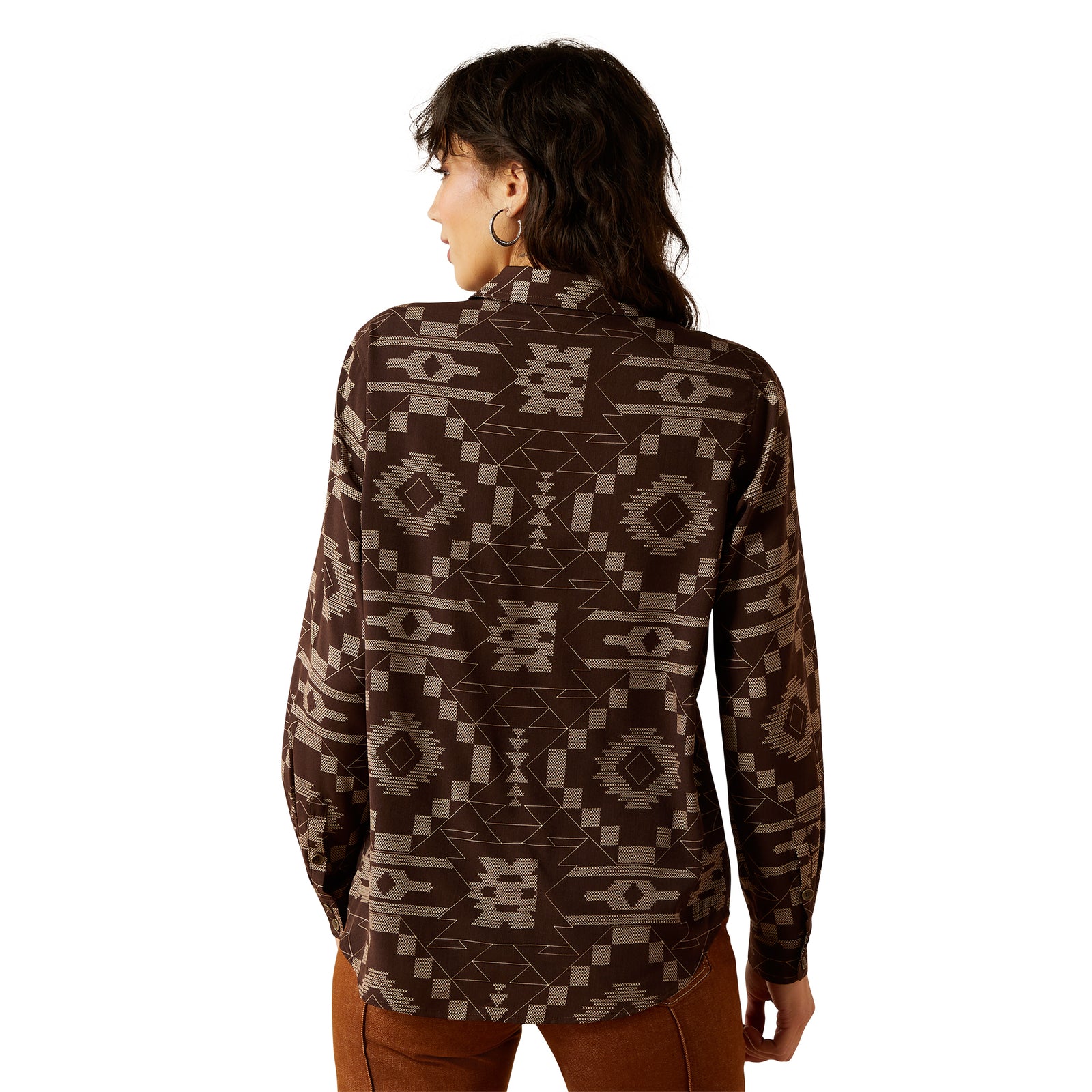 Woman wearing a brown patterned shirt on a white background