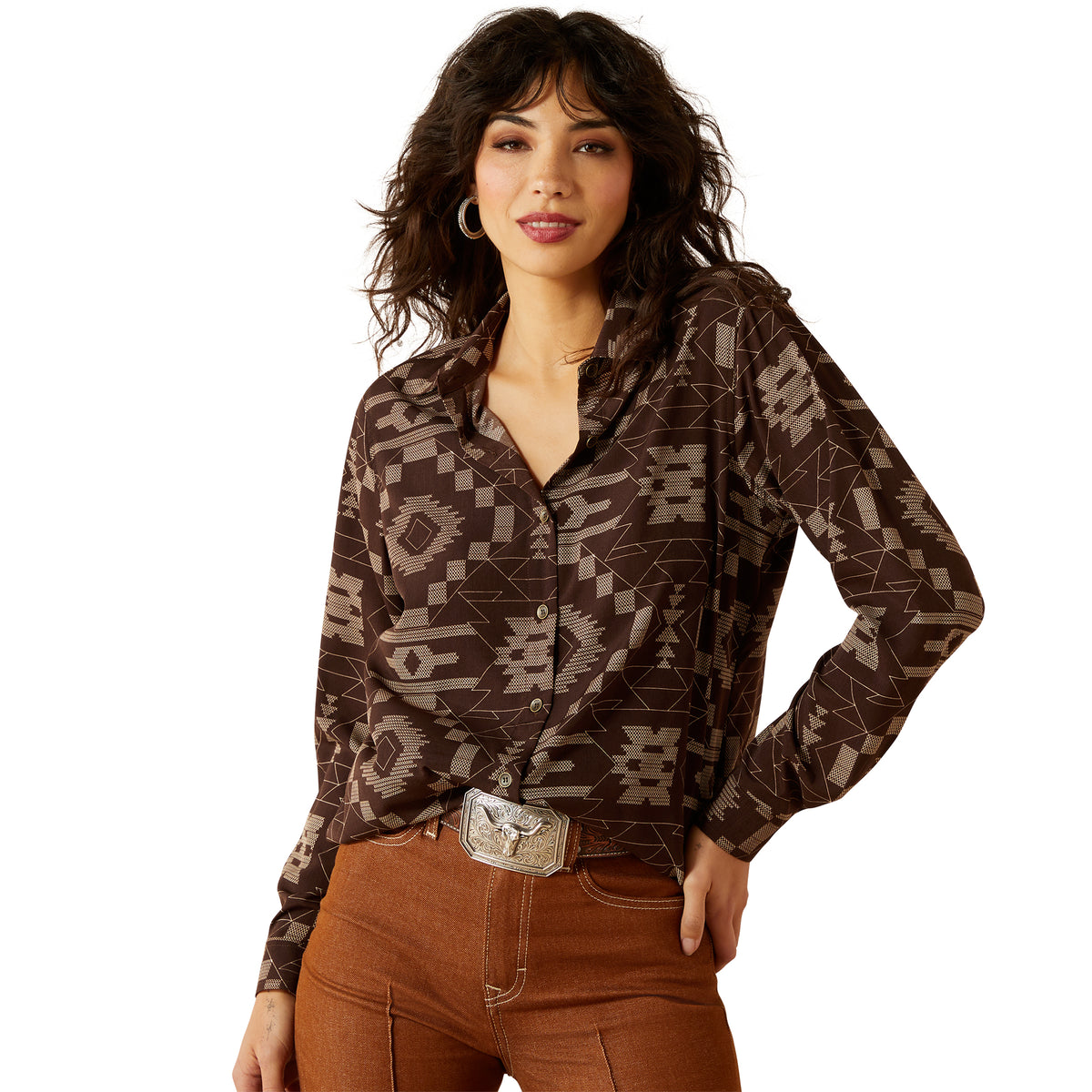 Woman wearing a patterned brown shirt and brown pants on a white background